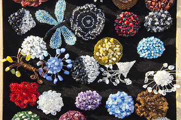 Image showing Decorative handmade jewelry sold at market fair 