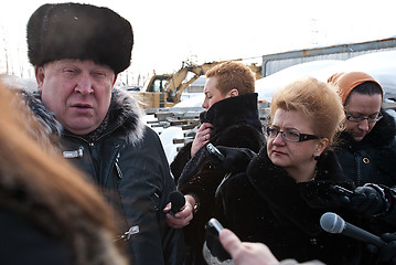 Image showing The Nizhny Novgorod governor Valery Shantsev talks to mass media reporters in winter at a construction site