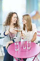 Image showing Women toasting with white wine