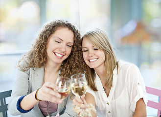 Image showing Women toasting with white wine