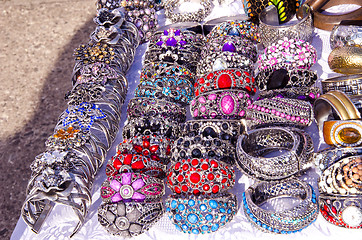 Image showing handmade jewelry bracelets head ring outdoor fair 