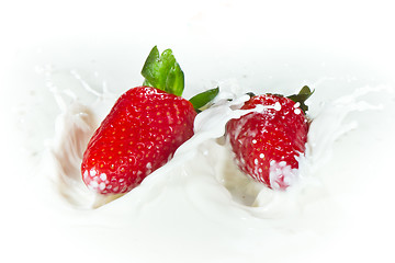 Image showing strawberry splashing into milk