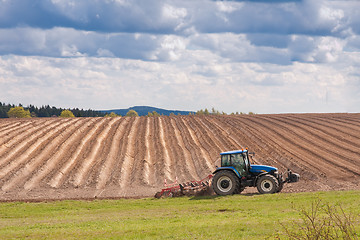 Image showing tractor plowing filed