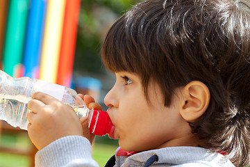 Image showing little boy drinking pure water