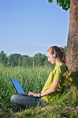 Image showing Girl with laptop in the country