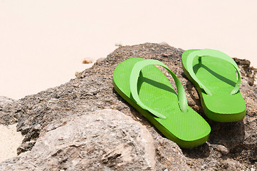 Image showing Flip flops on the beach