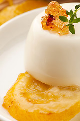 Image showing Vanilla Panna Cotta Dessert with lemon and fresh herbs