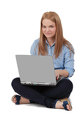 Image showing Young woman with a laptop