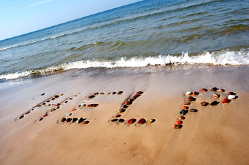 Image showing Word HELP on beach sand