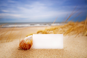 Image showing Shell and a blank card on the beach