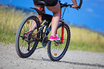 Image showing Active woman on a bike