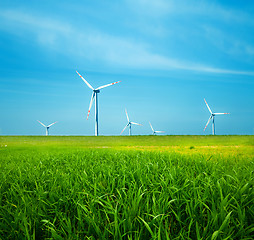 Image showing Wind turbines on green field