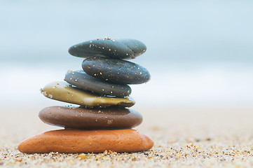 Image showing Stack of beach stones on sand