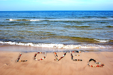 Image showing Word LOVE on beach sand