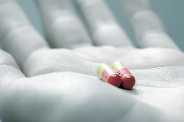 Image showing Taking pills