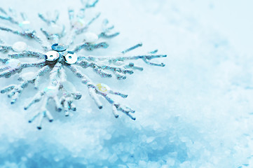 Image showing Snowflake in snow. Christmas