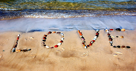 Image showing Word LOVE on beach sand