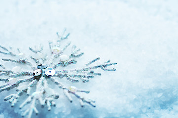 Image showing Snowflake in snow. Christmas