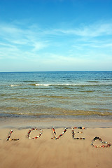 Image showing Word LOVE on beach sand