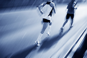 Image showing Two runners moving fast.