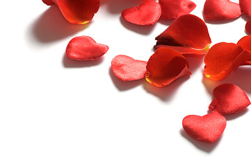 Image showing Rose petals and hearts on white background