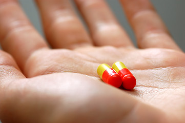 Image showing Taking pills