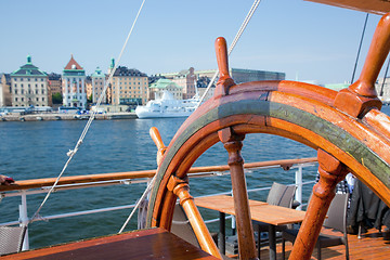 Image showing Ship helm and a view on Stockholm, Sweden