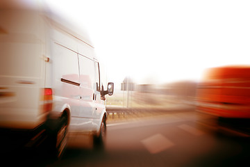 Image showing Trucks, delivery vans on freeway