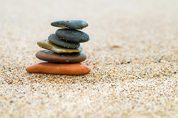 Image showing Stack of stones on sand