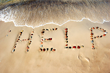 Image showing Word HELP on beach sand
