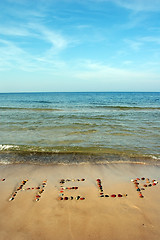 Image showing Word HELP on beach sand