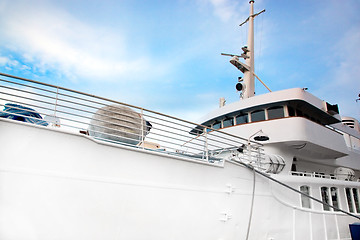 Image showing White tourist ship close up on blue sky