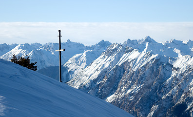 Image showing Winter mountains with cross