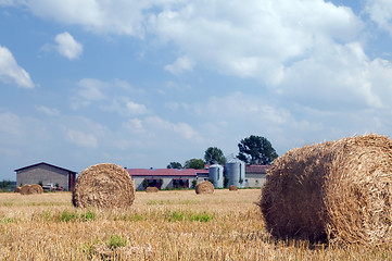 Image showing Farm buildings and haystacks