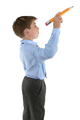 Image showing Student holding a pencil about to write