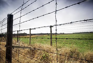 Image showing Barbed wire fence to prison