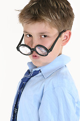 Image showing Child looking over top of round glasses
