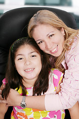 Image showing Close up of affectionate mother and daughter at home