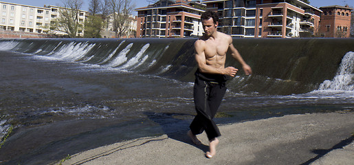 Image showing Man dancing outdoors.