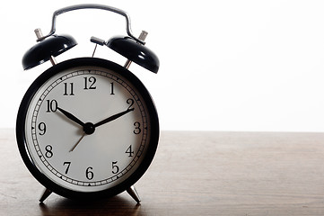 Image showing A simple clock against white isolated background