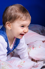 Image showing Cheerful young child in bed