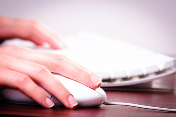 Image showing Hands of a woman using mouse and keyboard