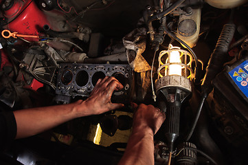 Image showing Hands of a worker repairing car