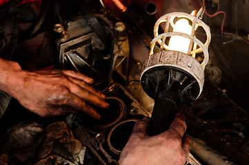 Image showing Mechanic worker inspecting car interiors