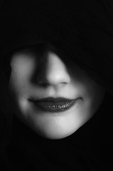 Image showing Woman in black hood