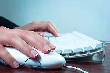 Image showing Hands of a woman using mouse and keyboard