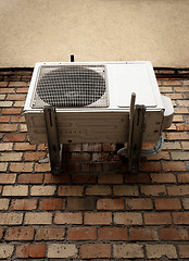 Image showing Air conditioner on brick wall