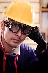 Image showing Hard working man in helmet