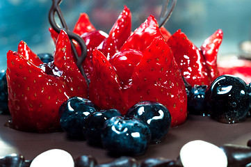 Image showing Delicious fruits on cake