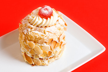 Image showing Almond cake on red